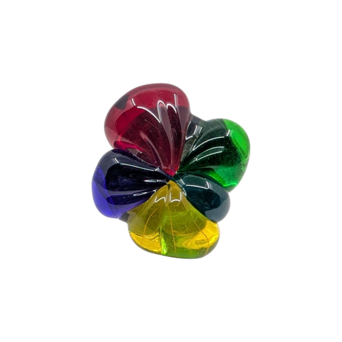 A small translucent flower-shaped ring with five petal-like sections in red, green, blue, yellow, and dark green, shown on a plain white background.