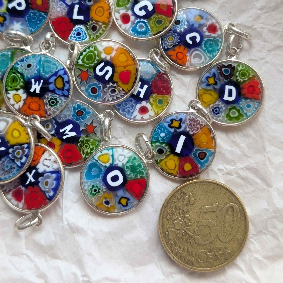 millefiori alphabet showing the size against a coin