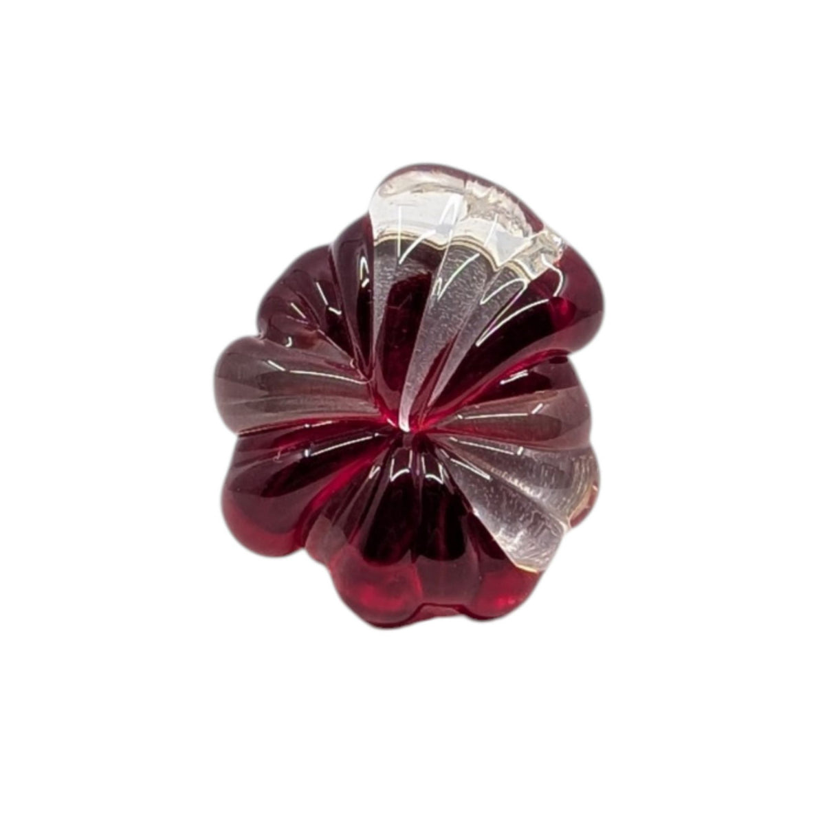 A single flower-shaped glass ring with a deep burgundy red exterior and a clear, faceted interior, shown on a plain white background.