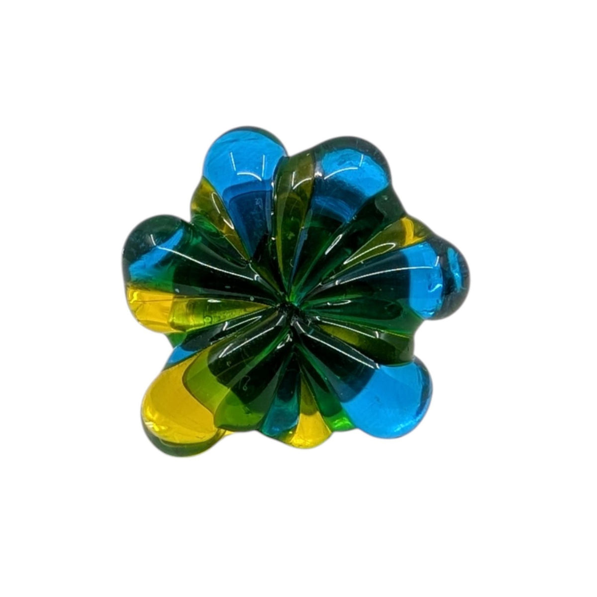 A translucent, multi-colored flower-shaped glass ring with alternating segments of blue and yellow, shown on a plain white background.