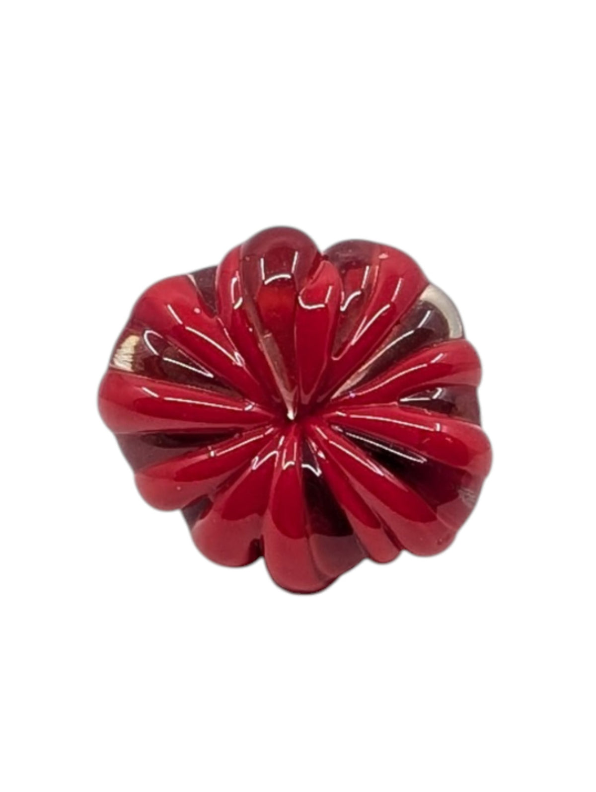 A glossy red, flower-shaped decorative ring accessory with a ribbed, petal-like design, shown on a plain white background.