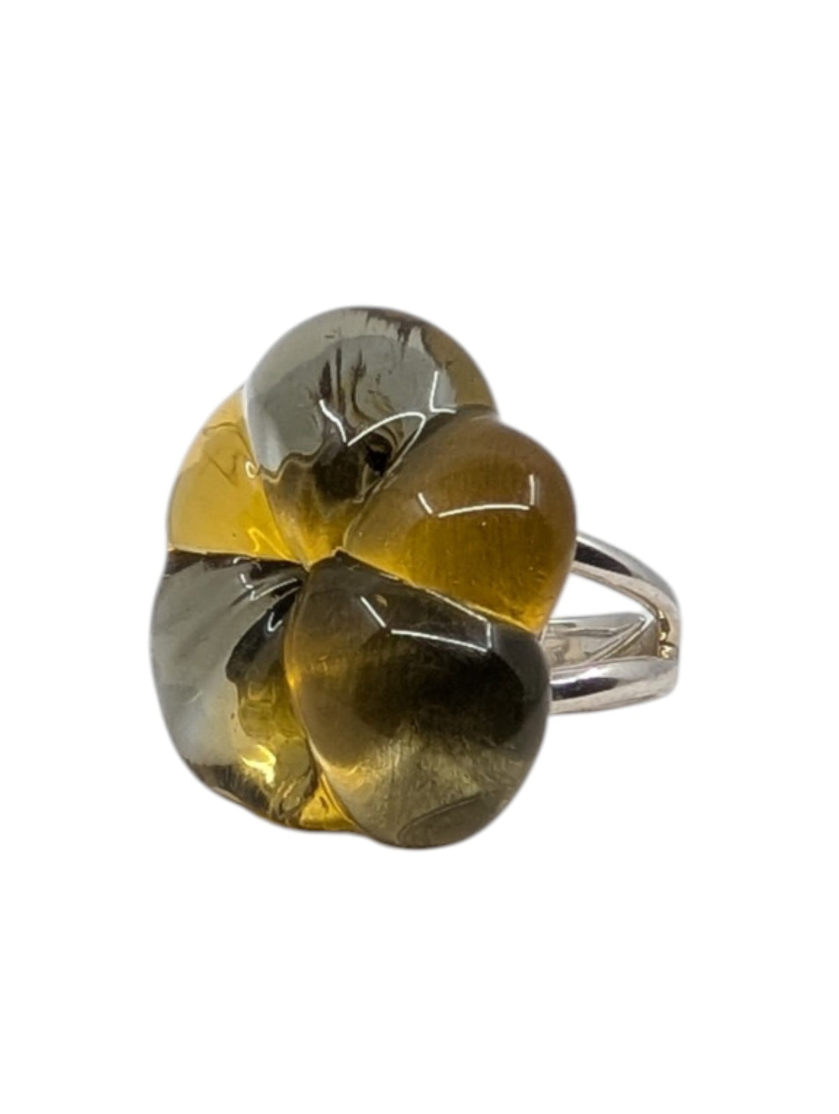 A silver ring featuring a large, organic-shaped cluster of translucent amber and smoky grey glass, isolated on a white background.
